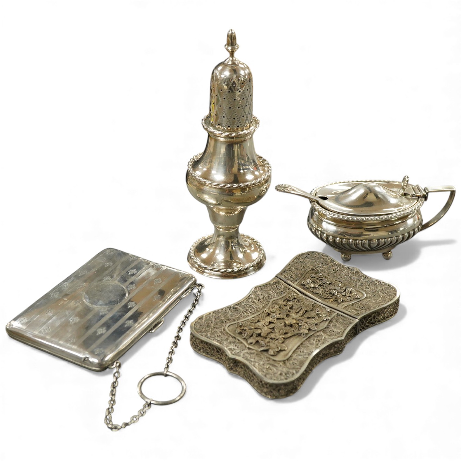 A modern silver pepperette, Birmingham, 1988, 14cm, a silver mustard pot and associated silver spoon, a silver mounted notecase and a filigree white metal card case.